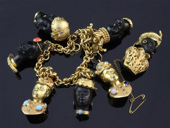 A mid 20th century Italian 18ct gold and gem set blackamoor charm bracelet and brooch